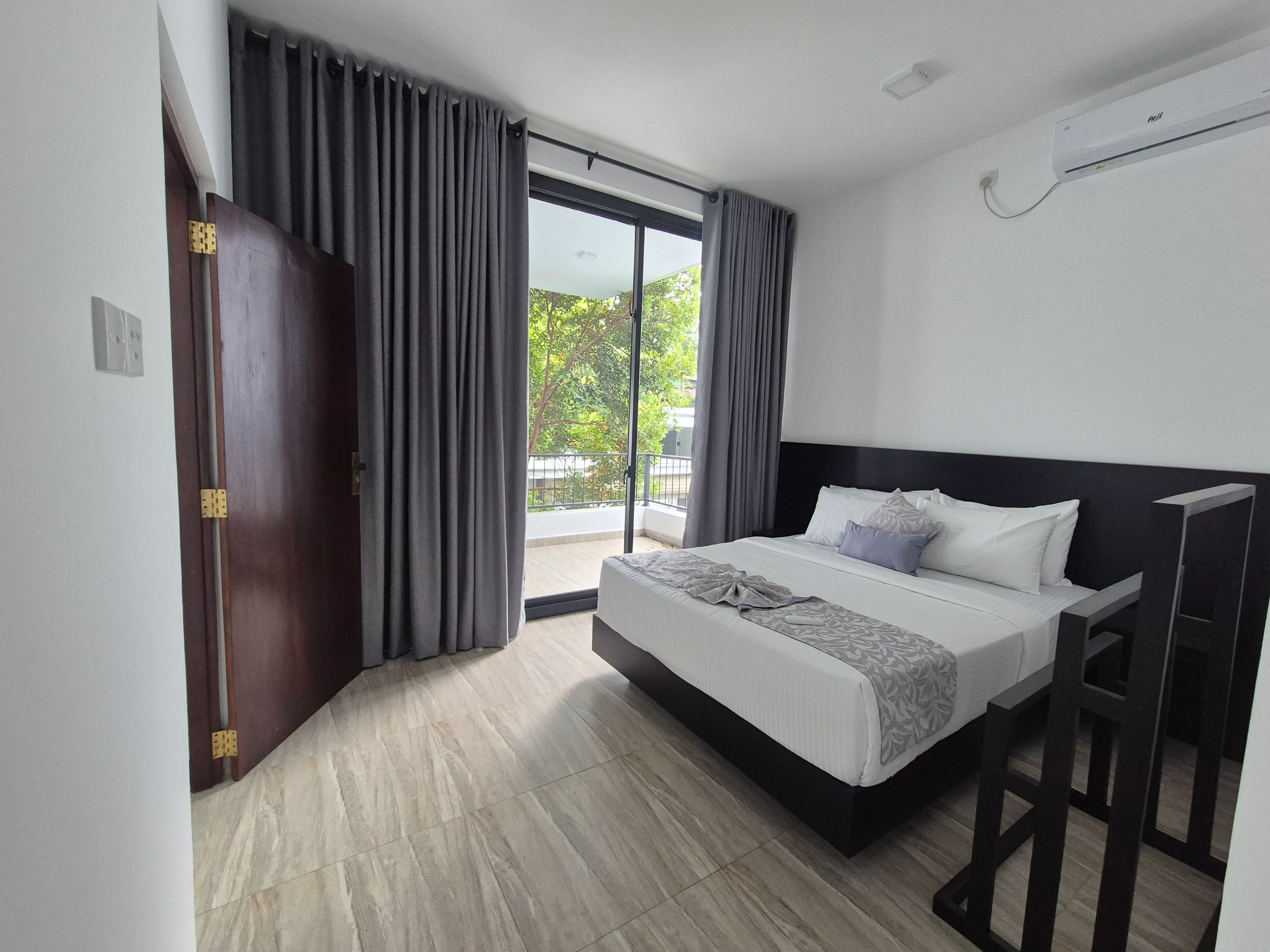 Upper suite bedroom at TenTwo with contemporary finishes