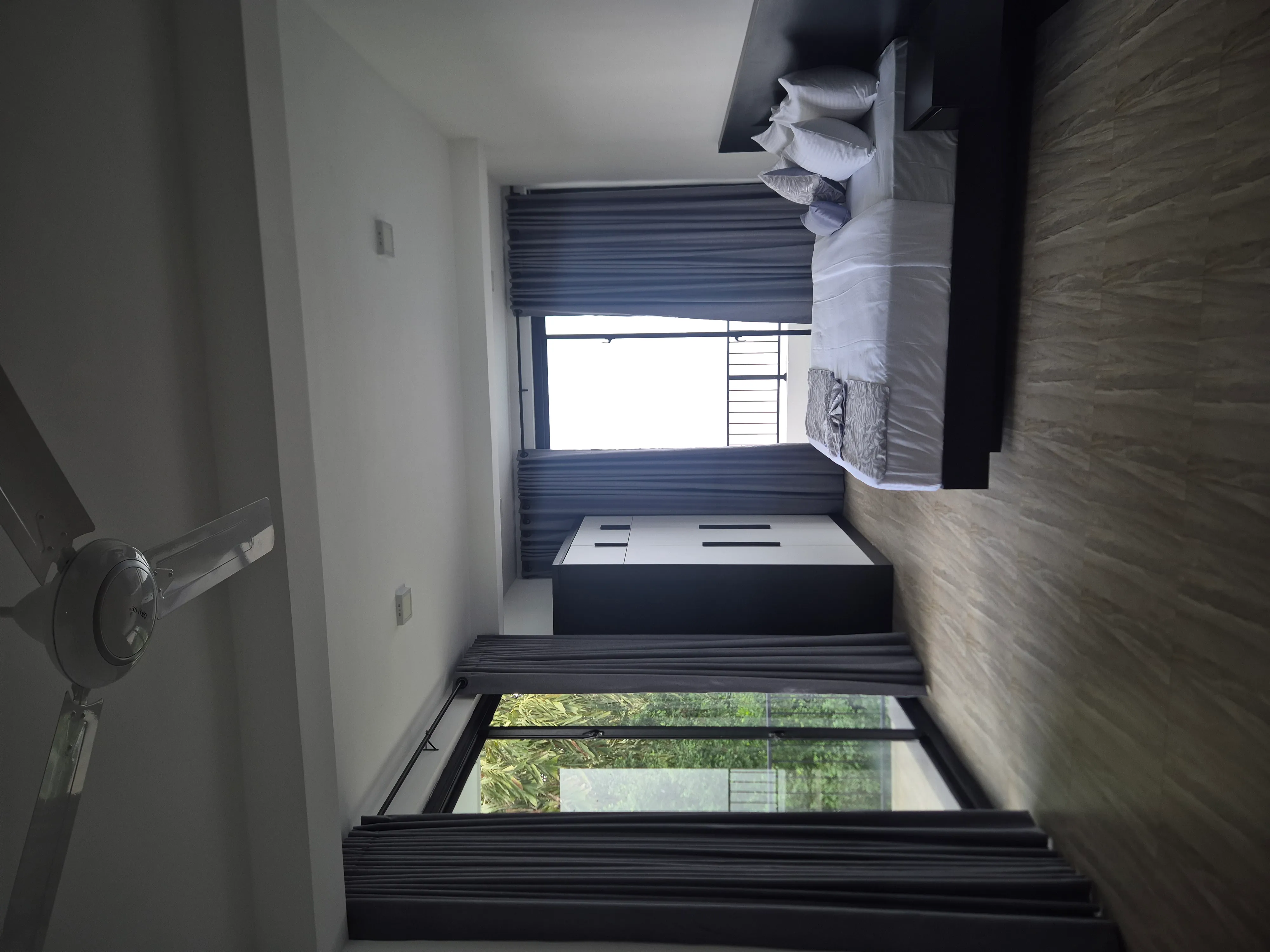 Master suite bedroom at TenTwo with contemporary design and natural light